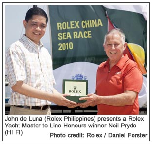 John de Luna (Rolex Philippines) presents a Rolex Yacht-Master to Line Honours winner Neil Pryde (HI FI), Photo credit: Rolex / Daniel Forster